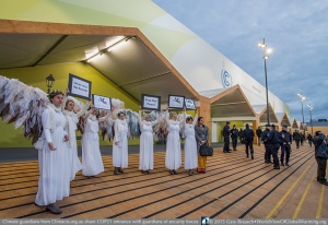 Climate Guardians from Australia Climacts.org.au at entrance to COP21 on the first day, reminding delegates of their duties — while civil guardians of the event security team stand watch also. Oldest is 17 year old June Norman is a mother of five, a grandmother of eight and a great-grandmother of three children. She is the first person in Australia to have been arrested for taking direct action against gas fracking.